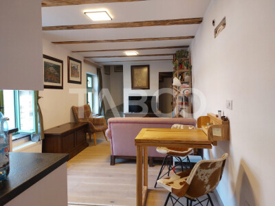 Apartament de vanzare 105 mp 3 camere curte 340 mp in acte Cisnadie